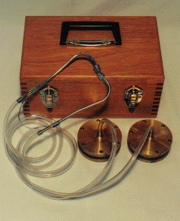 Geophone leak detector with brass sensing heads, stethoscope headset and wooden carrying case